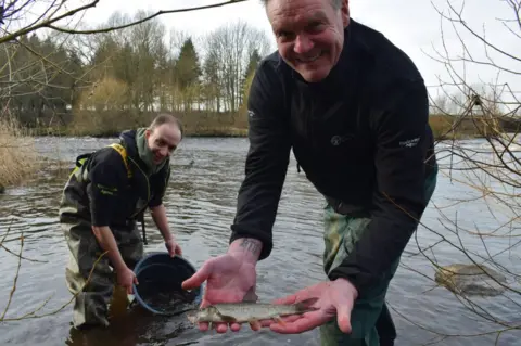 Environment Agency Officers with fish