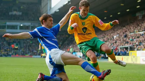 Getty Images Jonatan Johansson of Norwich City battles for the ball with Richard Naylor of Ipswich Town during the Coca-Cola Championship match between Norwich City and Ipswich Town at Carrow Road on February 5, 2006 