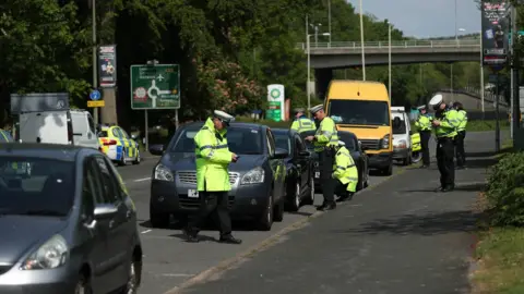 PA Media Police stopping cars between London and Brighton