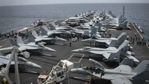 EPA Handout photo from US Navy shows fighter jets on the deck of the USS Abraham Lincoln in the Arabian Sea on 19 May 2019