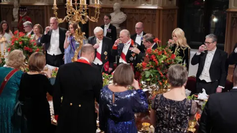 PA Media A middle-distance shot of the banquet with the King, Steinmeier, Catherine, William, Claudia Schiffer and Starmer visible.