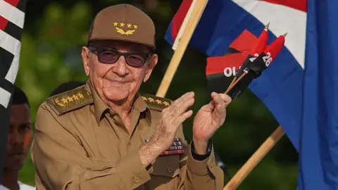 Raul Castro, in a khaki military uniform and sunglasses, is seen in Havana, Cuba in 2022