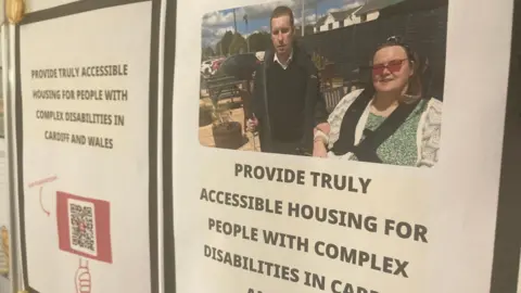 Katherine Dutson and husband James on poster campaigning for disability rights