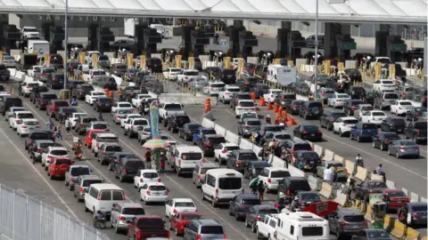 Reuters Cars queuing up at at the Mexico and Us border on March 29