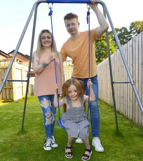 ARTHUR ALLISON, PACEMAKER Violet on a swing with her mum Shelbie and dad Gareth