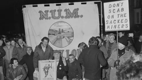 Getty Images Striking mine workers during the miners’ strike picket the Maerdy Colliery in 1985