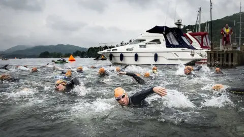 PA Media Swimmers take part in the Great North Swim on Lake Windermere in Cumbria