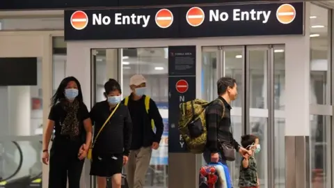 EPA Australian nationals arrive in Sydney after a quarantine on Christmas Island. Photo: 17 February 2020