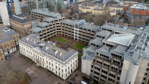 The Royal Mint site aerial view including many white buildings 