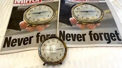 Mike Flynn Clock and newspaper photos of it