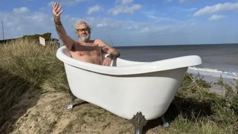 Andrew Turner/BBC Lance Martin in a bath