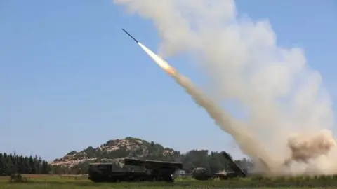 EASTERN THEATRE COMMAND/Reuters A long-range live-fire missile launched from an undisclosed location by China's People's Liberation Army on 5 August