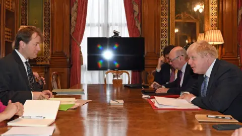 PA Richard Ratcliffe and Boris Johnson at the Commonwealth office