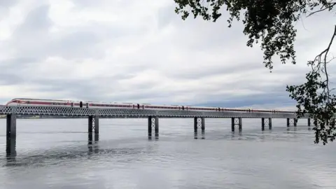 Alastair Nunn Train on a bridge