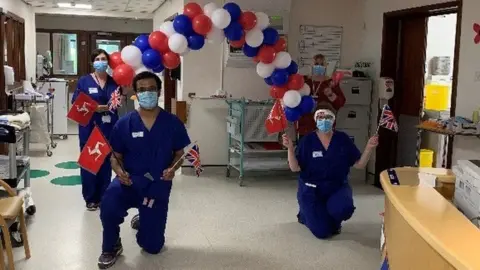 IOM GOV Hospital staff with balloons and Manx flags