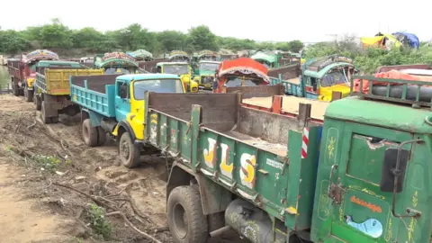 BBC Trucks full of sand in Andhra Pradesh
