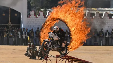 MANJUNATH KIRAN A member of the 'Tornadoes', a motorcycle stunt team belonging to Army Service Corps, performs during celebrations for the India's 74th Republic Day in Bengaluru on January 26, 2023.