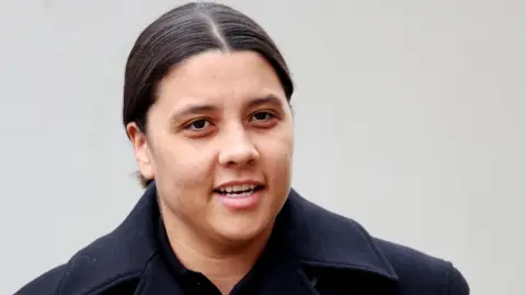 EPA Samantha Kerr on her approach to court. She is wearing a dark winter coat and has her dark hair tied back