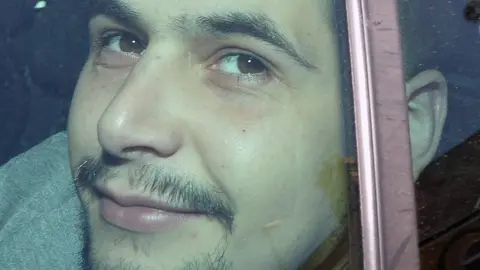 PAcemaker James Andrew Thomas McVeigh pictured outside Lisburn Court in June 2019, looking out through the window of a car