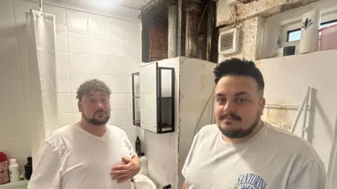 James and Taylor Wilson in the bathroom of their ground floor council flat in Shirley