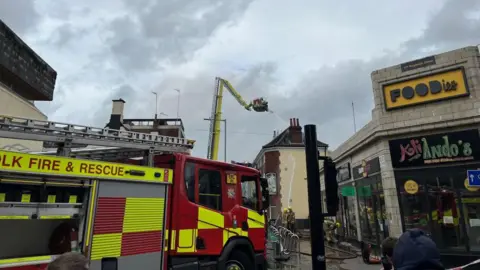 Jack Maclean/BBC A fire engine at the site of a fire at a former pub on Magdalen Street in Norwich.