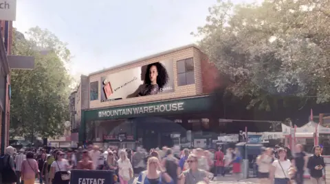 In the background of a busy street screen we see a model in an advert on a giant screen above the Mountain Warehouse shop in Norwich.