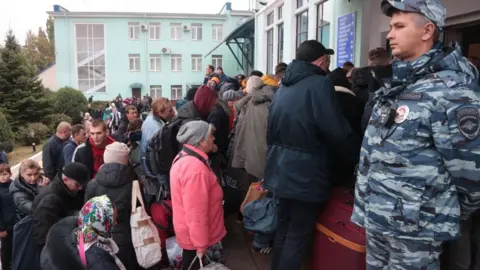 Getty Images People evacuated from Kherson at Dzhankoi railway station in Crimea