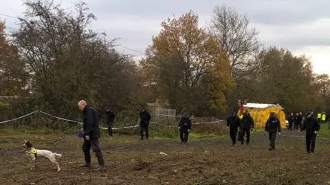 South Yorkshire Police Police officers search land near Bentley, Doncaster
