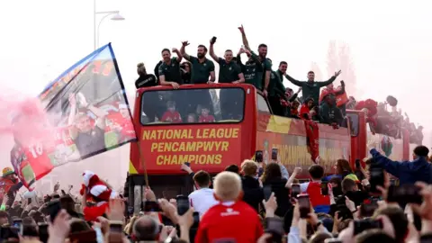 Reuters bus going through the crowd