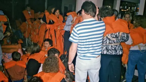 Passengers in lifejackets on board the Oceanos