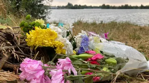 Flowers next to lake at Cotswold Water Park