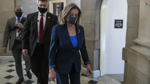 EPA Speaker of the House Nancy Pelosi walks to her office from the House floor