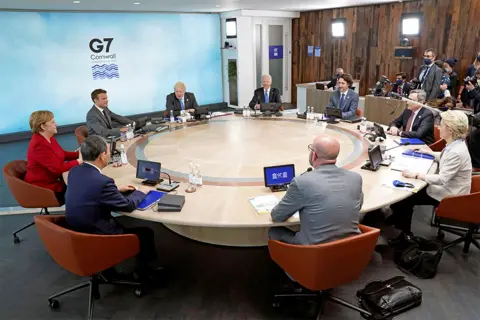 Reuters The leaders attending the G7 summit sit around a table in Cornwall