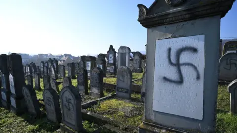 Getty Images Graffiti at a Jewish cemetery in France
