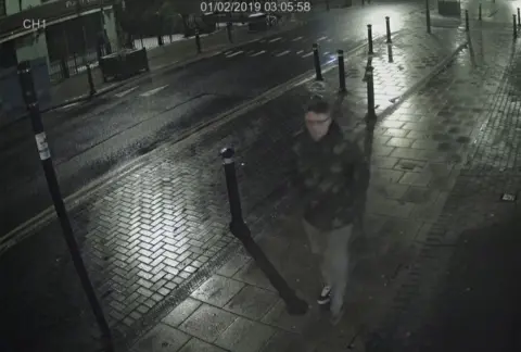 Humberside Police CCTV still of Pawel Relowicz walking on the pavement of a main road