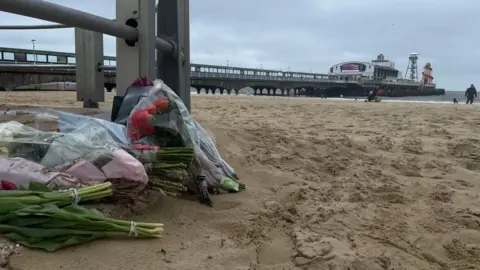Flowers have been left at the scene of the stabbing