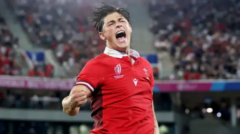 Louis Rees-Zammit celebrates victory for Wales at the 2023 Rugby World Cup 