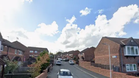 Foster Square in Leeds, showing brick-built houses on a sunny day.