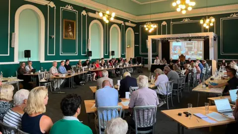 A packed council chamber