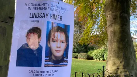 A poster - showing two images of Lindsay Rimer a teenage girl with curly hair - on a tree in a green park 