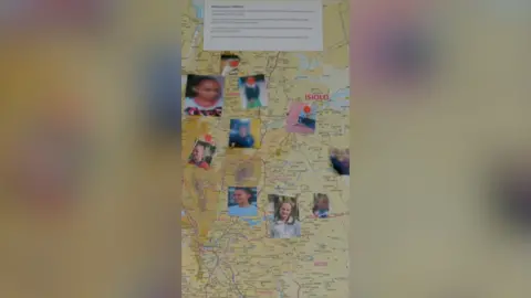 A map with passport-style photos of people stuck on different areas