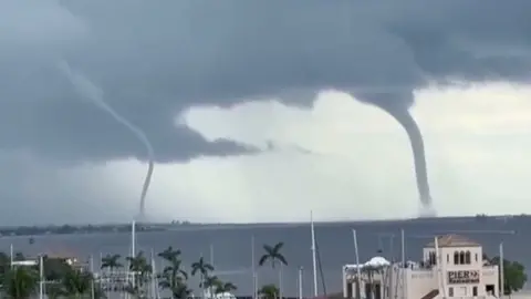 Two waterspouts are spotted over the Manatee River.