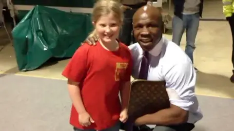 Hennessy Sports Fran as a child posing with former world champion Chris Eubank, who she knew because her father Mick was a promoter and worked with Eubank Jr.