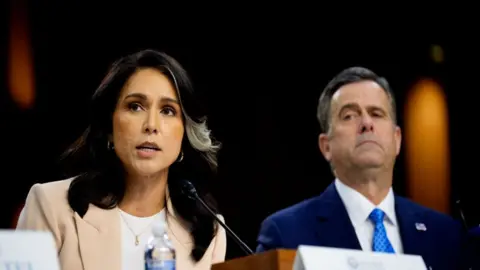 Tulsi Gabbard and John Ratcliffe at the hearing on Capitol Hill