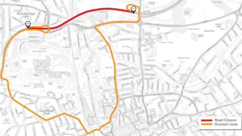 National Highways A map showing a road closure highlighted with a red line and a lengthy diversion route marked in orange