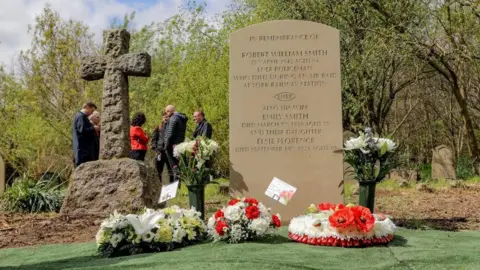 LNER A close-up of Robert Smith's gravestone with wreaths laid in front