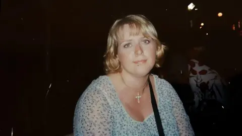 Supplied Clare Wood in a photo album