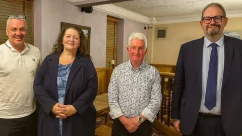 Reform UK Hartlepool From left, councillors Ed Doyle, Amanda Napper, Rob Darby and Mike Young stand in a room looking ahead at the camera.
