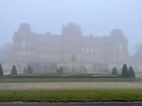Wynd-y-Miller/ Weather Watchers Barnard Castle in County Durham is a grand manor in the style of a French chateau. Built over three storeys, it has a central tower with two wings set back and running along to towers at either end. In front is a raised level made from giant stones. Below that is a manicured garden with well-trimmed trees. It is shrouded in mist.