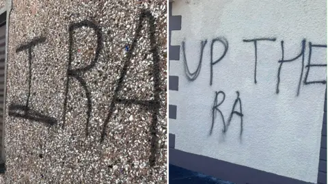 John McAuley Graffiti on the side of a building. The composite image shows two images of graffiti. On the left the graffiti reads "IRA" in black on a pebbledashed wall. On the right the black paint reads "UP THE RA" on a white wall.
